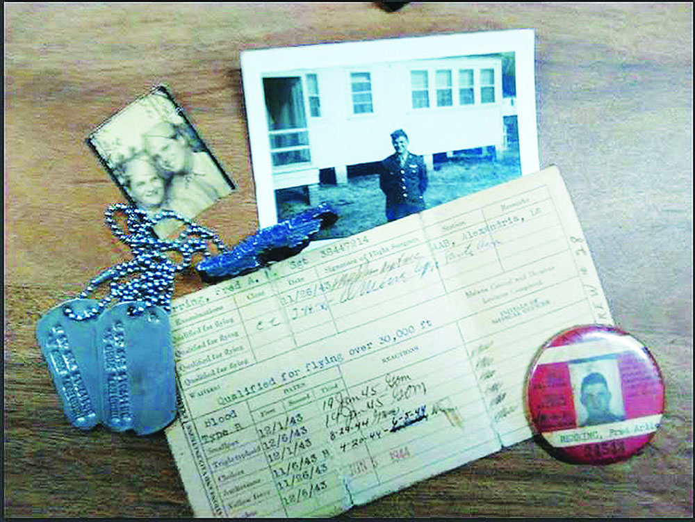 Photos, dog tags, and shot records of Fred Herrings service